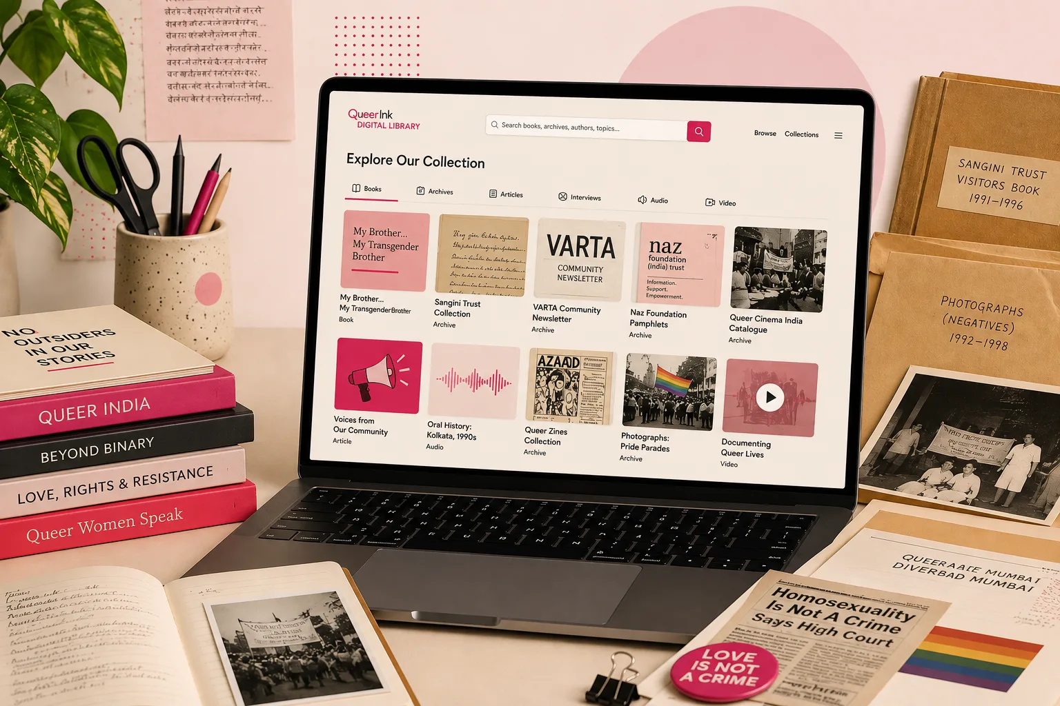Digital Library.png Illustration of a laptop showing a concept design for the Queer Ink Digital Library, surrounded by queer Indian books, archive boxes, photographs and a 'Love is not a crime' badge.